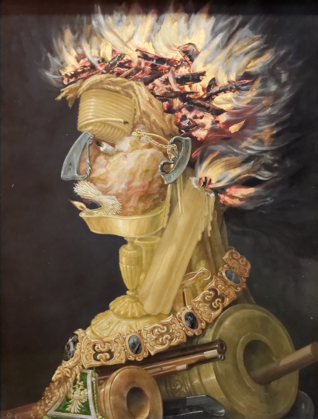 ジュゼッペ・アルチンボルド『火』(1566年、クンストヒストリシェス美術館)。火に関連する事物の集積で構成された寓意的頭部像